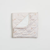 Reusable change mat in a soft nude with clouds, stars and moon etc printed on it. Luxe quilted finish with a soft bamboo terry, machine washable, perfectly paired with modern cloth nappies