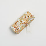 Reusable change mat in a happy floral print of mustards, greens, peach and rust called summer haze. Luxe quilted finish with a soft bamboo terry, machine washable, perfectly paired with modern cloth nappies, bee details on snaps.