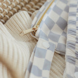 Close up of details of the so checked out print with beautiful golden zip detail. Also features a training pant in So checked out.