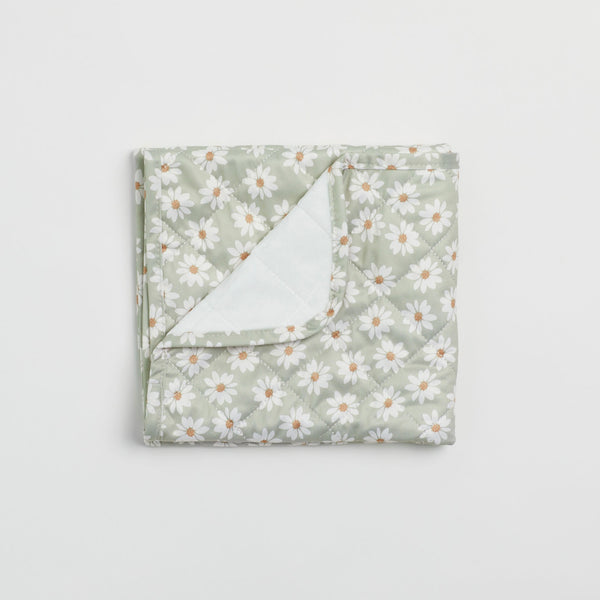 Reusable change mat in a soft sea mist green based daisy print. Luxe quilted finish with a soft bamboo terry, machine washable, perfectly paired with modern cloth nappies, bee details on snaps. 