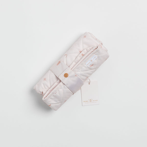 Reusable change mat in a soft nude with clouds, stars and moon etc printed on it. Luxe quilted finish with a soft bamboo terry, machine washable, perfectly paired with modern cloth nappies
