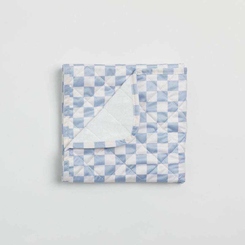 Reusable change mat in a blue and white check. Luxe quilted finish with a soft bamboo terry, machine washable, perfectly paired with modern cloth nappies, bee details on snaps. 